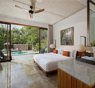 Master bedroom view of the garden and swimming pool area at Uma Santai Villa