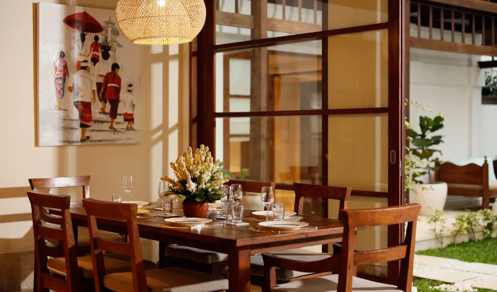 Modern Balinese dining area with wooden table and chairs at Villa The Seven
