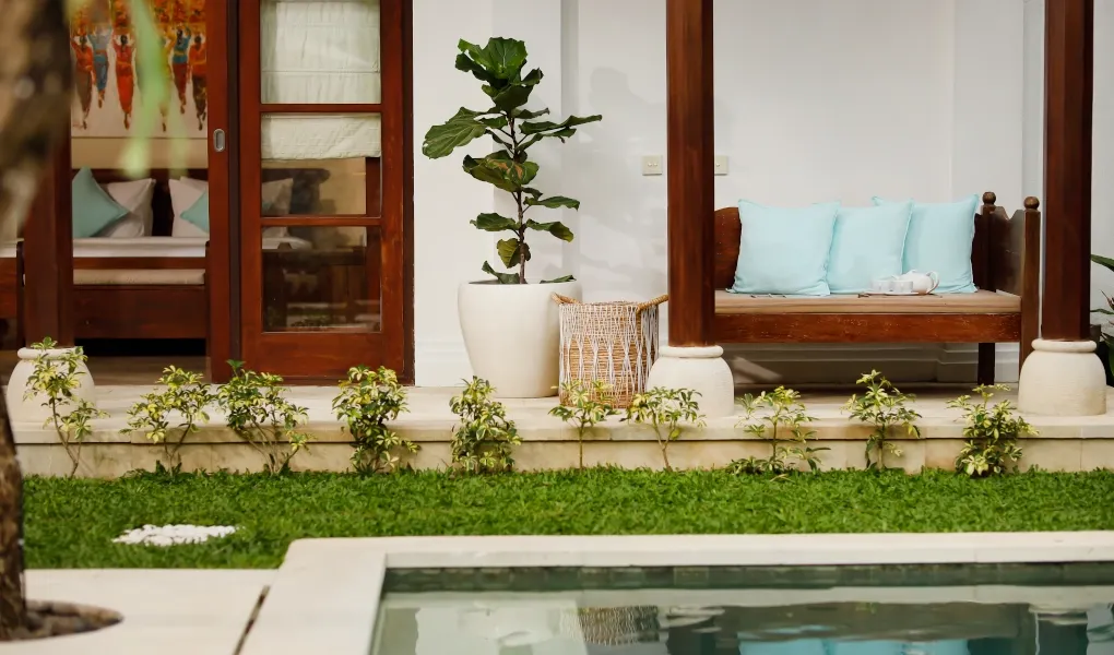 Outdoor lounge area by the pool, with a daybed at Villa The Seven