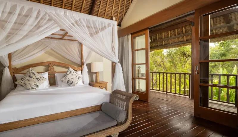 Spacious master bedroom with balcony view at Villa Grasshopper