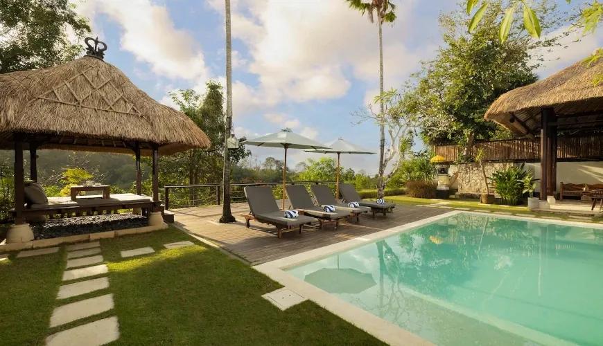 Serene pool and lush garden view at Villa Grasshopper