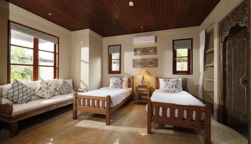 Comfortable twin bedroom with traditional design at Villa Grasshopper