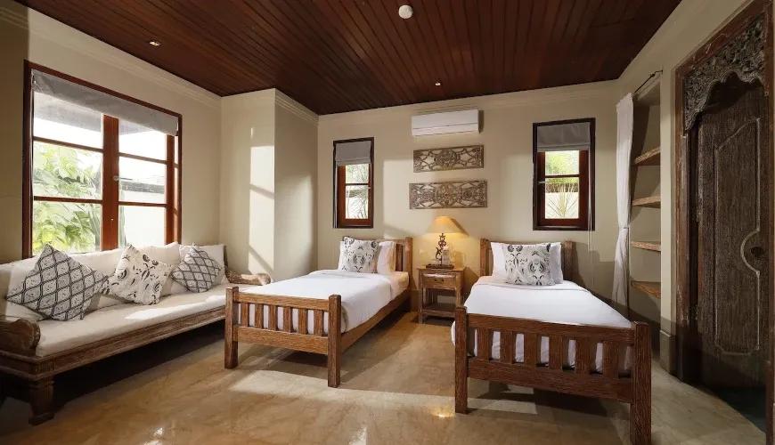 Comfortable twin bedroom with traditional design at Villa Grasshopper
