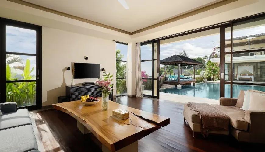 Luxury living room, pool view, indoor-outdoor. Villa Jamalu