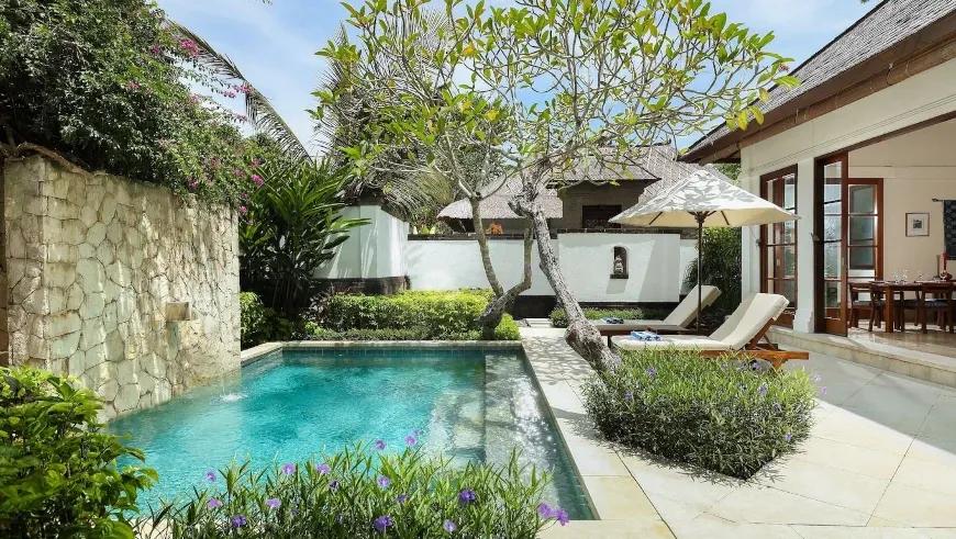 Tropical garden pool, stone wall at Villa Shanti