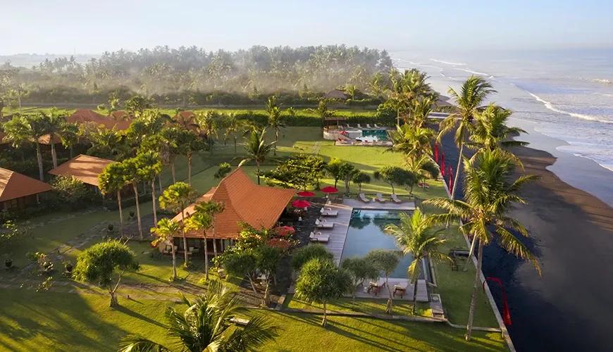 Aerial view of a luxurious beachfront resort with pools at amarta beach retreat