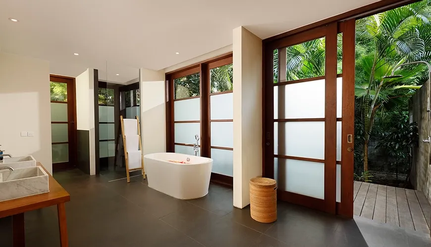 Beautiful master bath with a large vanity and sleek fixtures at Amita Villa