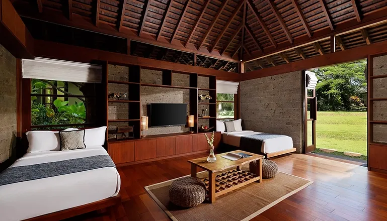 Relaxing bedroom with a large bed perfect for peaceful rest at Amita Villa