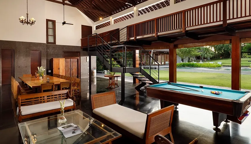 Spacious living room with a billiards table and comfortable seating at Amita Villa