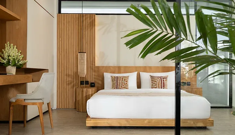 Comfortable bedroom featuring a large bed and a workspace at Arita Villa