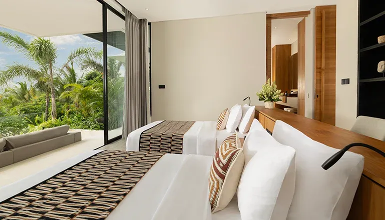 Luxurious bedroom with two beds and a modern design at Arita Villa