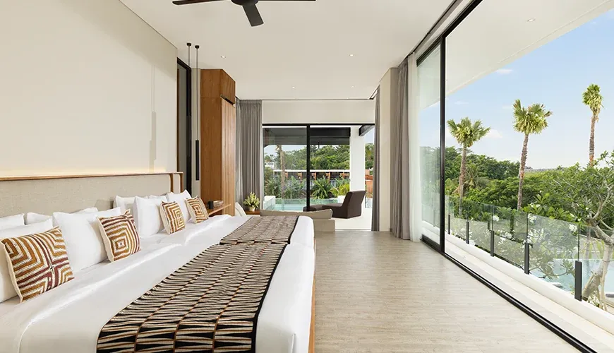 Luxurious master bedroom with a personal lounge pool and garden view at Arita Villa