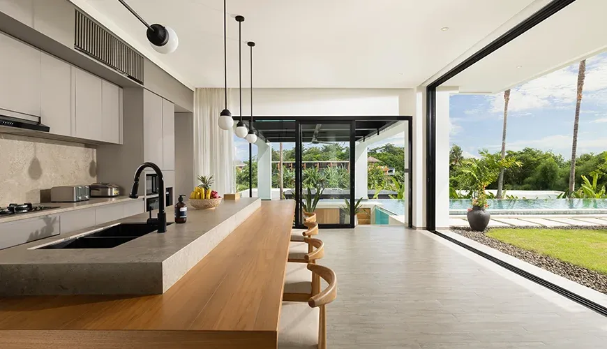 Spacious villa kitchen with a sleek design and barstools at Arita Villa