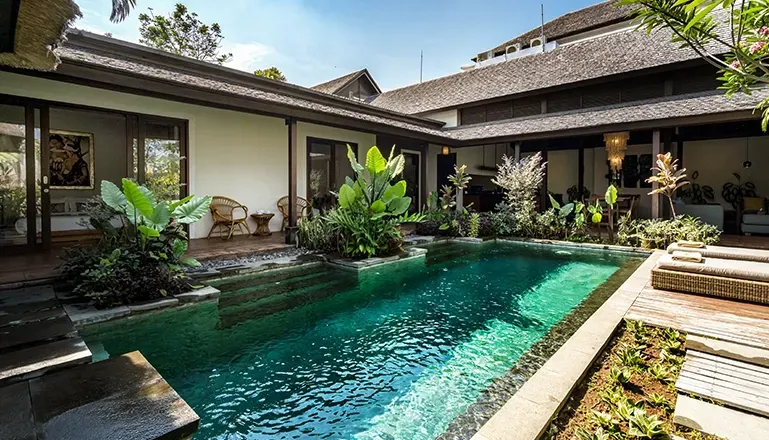 spacious villa private pool lush green plants outdoor sun loungers canggu