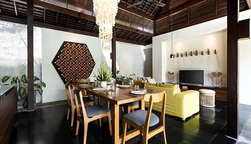 Balinese villa living room with tropical pool and garden view at Bumbak Park