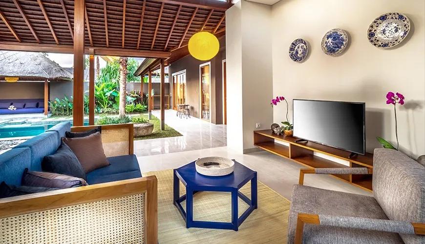 Balinese villa living room with tropical pool and garden view at bumbak park