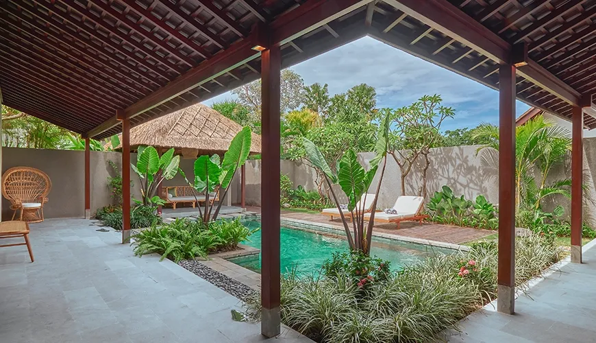 Covered patio villa private pool tropical garden lounge chairs outdoor living at Bumbak Park