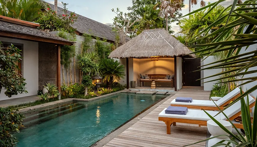 Luxurious villa with private pool, sun loungers, cabana, and tropical garden at Bumbak Park