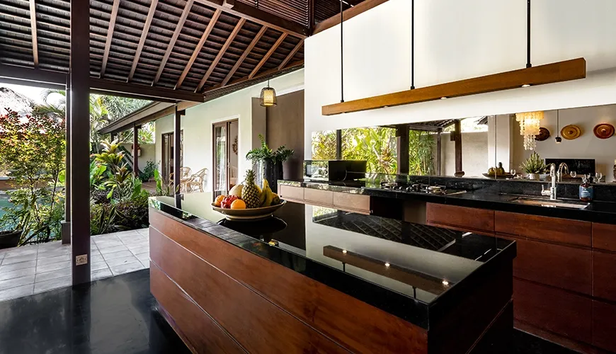 Modern villa kitchen island black countertop wooden cabinets open design at Bumbak Park