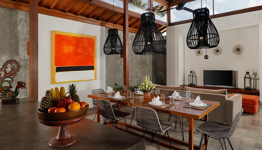 Open-plan Balinese living and dining room with modern decor at Bumbak Park