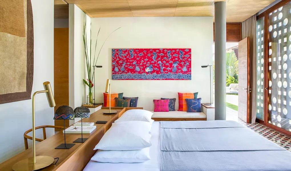 Colorful Balinese-style bedroom with traditional art and decor at casaBama