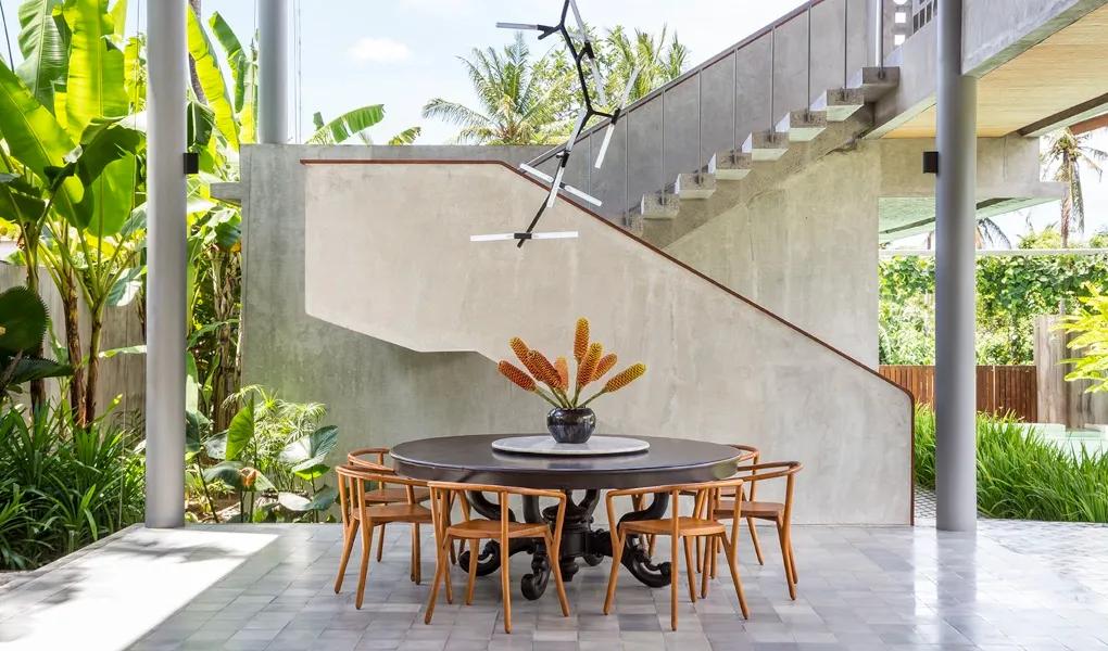 Modern dining table in an open-air tropical setting at casaBama