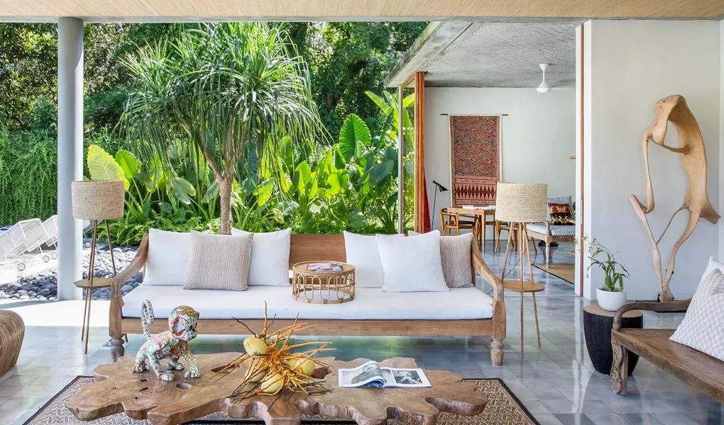 Open-air living room overlooking a tropical garden at casaBama