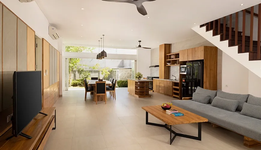 Contemporary living space featuring a comfortable sofa and TV at Christie Villa