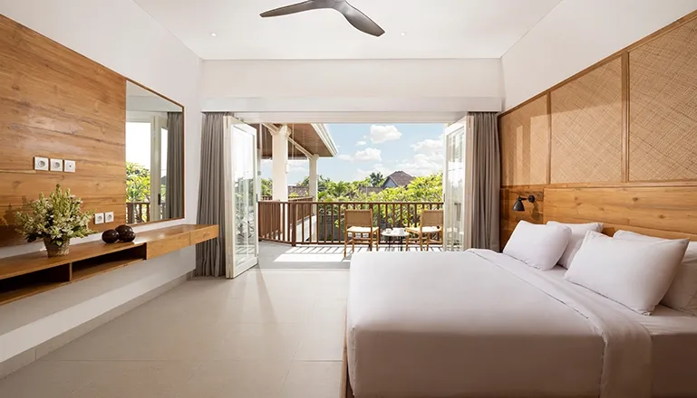 Elegant bedroom with a comfortable bed and light-filled space at Christie Villa