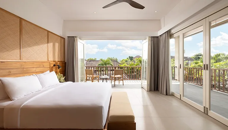 Elegant sleeping space with ample light and serene ambiance at Christie Villa