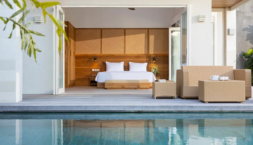 Luxurious master bedroom opening to a private swimming pool at Christie Villa