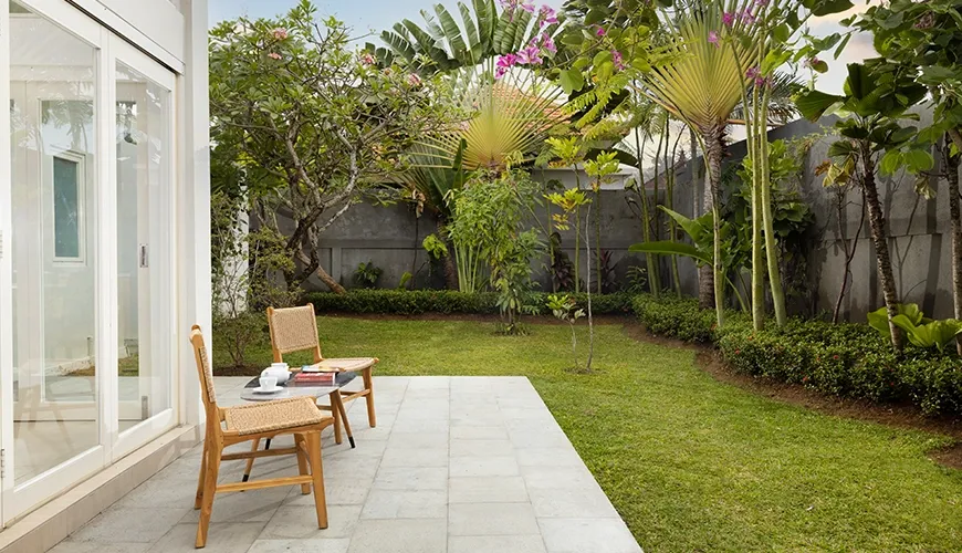 Serene outdoor space featuring vibrant flora and quiet corner at Christie Villa