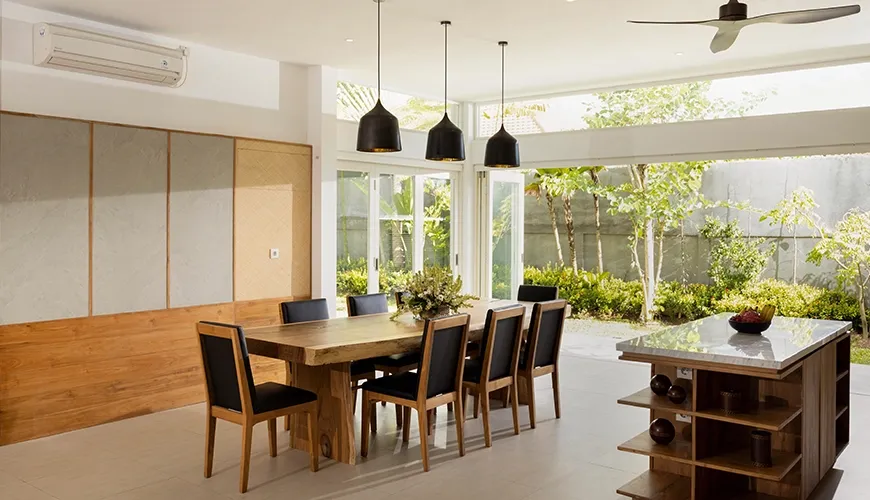 Spacious indoor dining room with natural light and outdoor view at Christie Villa