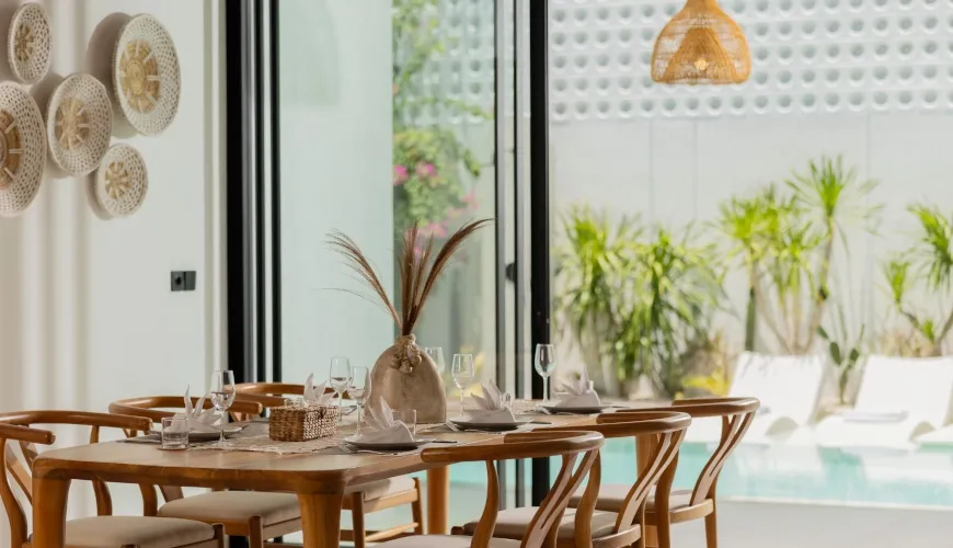Bright Bali dining area overlooking a private pool at Fenta Villa