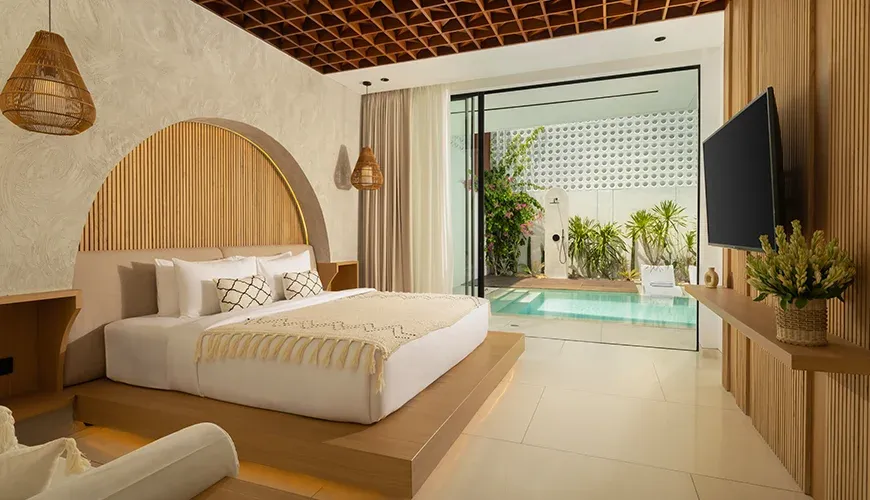 Elegant master bedroom with a swim-out pool access at Fenta Villa