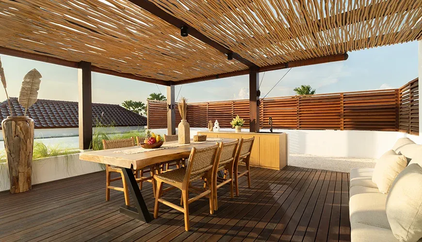 Expansive rooftop lounge with an elegant outdoor dining table at Fenta Villa