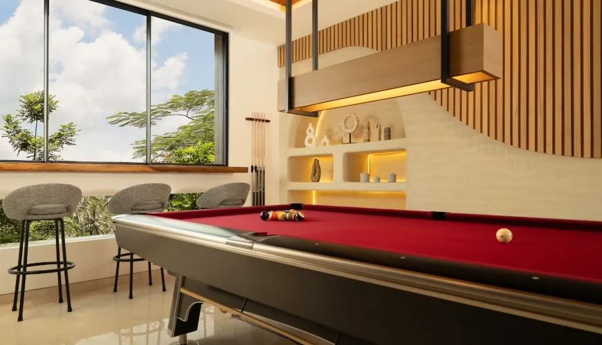 Luxury billiards room with red felt table and large window at Fenta Villa