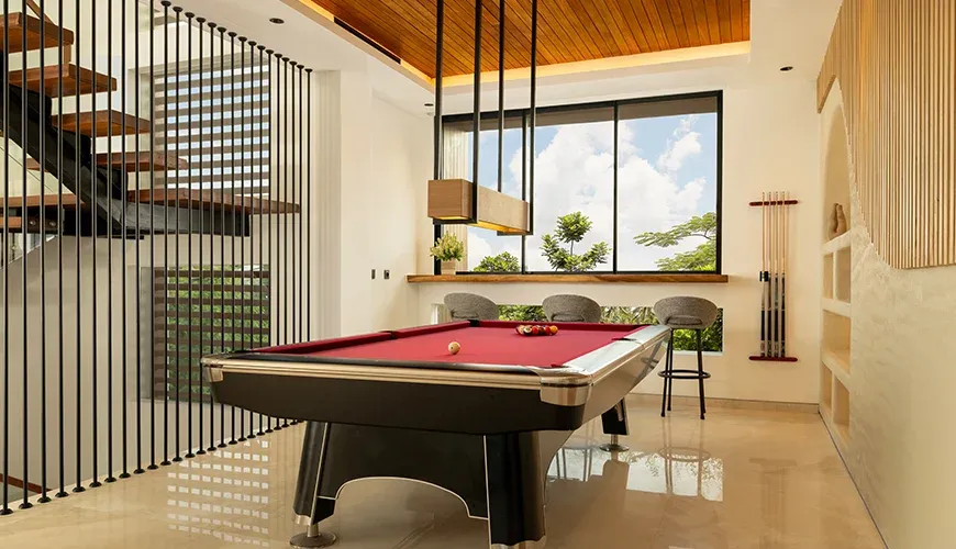 Modern billiards room with a pool table and bar stools at Fenta Villa