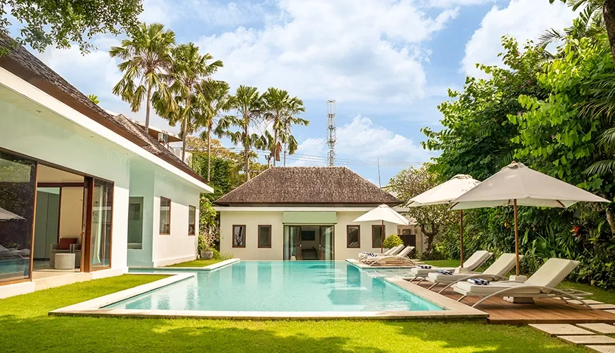 Entire luxury villa property showcasing a private pool, multiple buildings, and lush tropical gardens at Istana Putih Villa