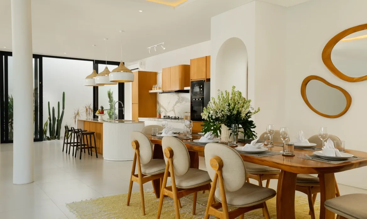 Contemporary open-plan dining and kitchen area for entertaining guests at Kalem Canggu