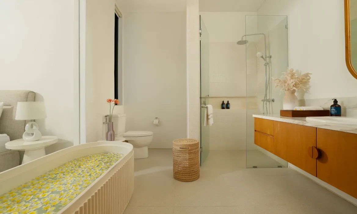 Spacious master bathroom with soaking tub and double vanity at Kalem Canggu