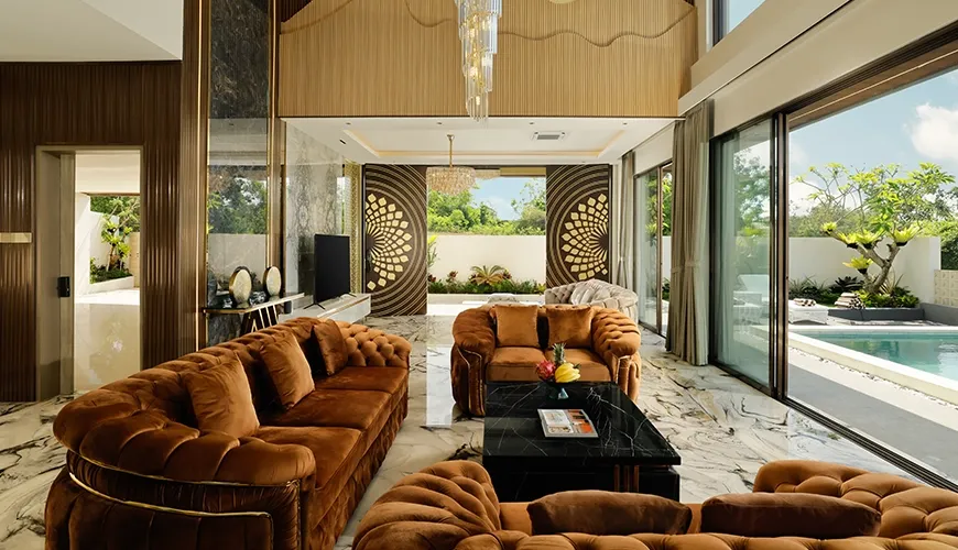 Luxurious living room with elegant brown velvet couches and a unique marble floor design at Kalem Uluwatu