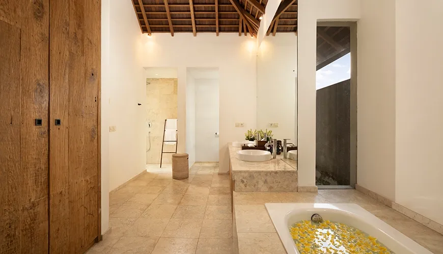 Elegant master bathroom large vanity deep soaking tub petals at Kuma Umalas Villa