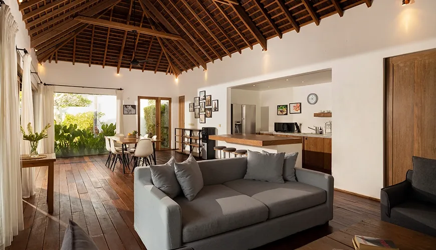 Spacious villa living room high wooden ceiling kitchen view at Kuma Umalas Villa