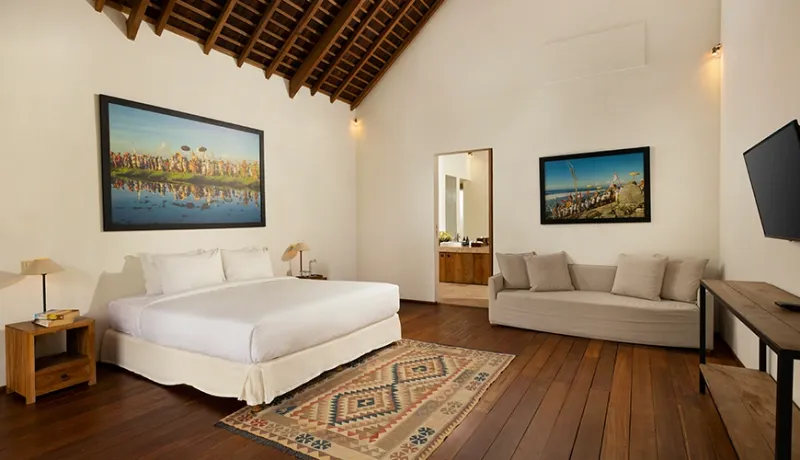 Villa master bedroom king bed sofa wooden ceiling at Kuma Umalas Villa