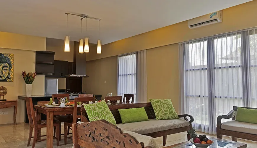 Beautiful kitchen and dining room in a tropical villa setting at Kumuda Villa