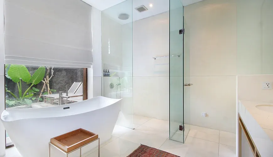 Luxurious bathroom featuring a standalone tub and modern fixtures at Leceni Villa