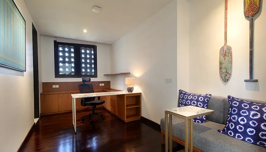 Modern study room with a desk and comfortable seating at Leceni Villa