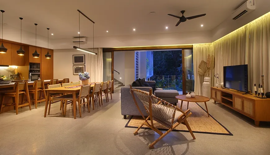 Spacious open-concept living, dining, and kitchen area with modern design at Leceni Villa