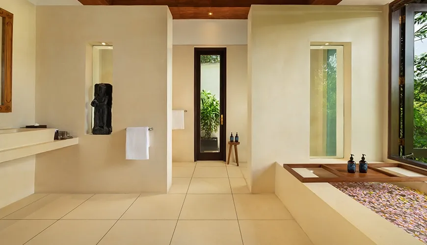 Elegant bathroom with a big soaking tub and beautiful natural outdoor scenery at Leona Suweta